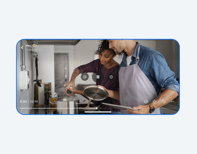 A video showing two people cooking takes up an entire screen. 