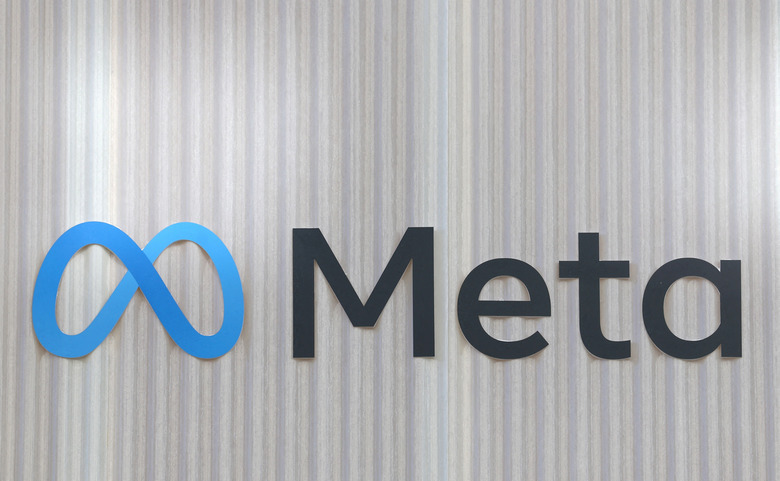 FILE PHOTO: The logo of Meta is seen at the entrance of the company's temporary stand ahead of the World Economic Forum (WEF) in Davos, Switzerland January 18, 2025. REUTERS/Yves Herman/File Photo
