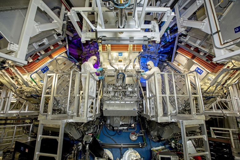 National Ignition Facility (NIF) Target Area operators inspect a final optics assembly (FOA) during a routine maintenance period at Lawrence Livermore National Laboratory federal research facility in Livermore, California, United States in an undated photo. 