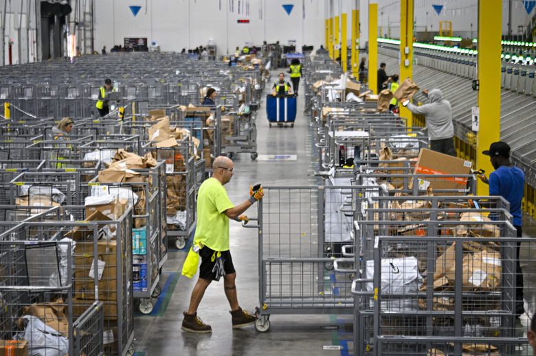 ORLANDO, FLORIDA  DECEMBER 2: Amazon employees work to fulfill same-day orders during Cyber Monday, one of the company busiest days of the year. The fulfillment center, one of Amazon largest for same-day deliveries, saw more than 200 workers sorting, packing and shipping items throughout Central Florida. On any given day, this location processes more than 20,000 packages, but during the holiday season, that number jumps to more than 80,000. (Photo by Miguel J. Rodriguez Carrillo/Getty Images)