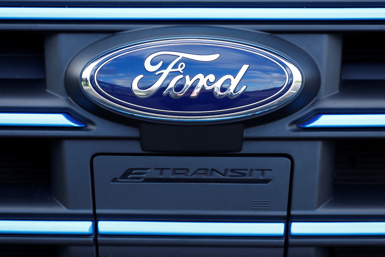 The Ford badge and E-Transit logo are seen on a vehicle at Ford’s Dunton Technical Centre in Dunton, Britain, January 13, 2023.  REUTERS/Peter Nicholls