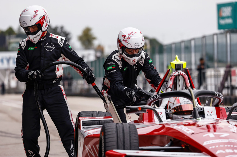 MADRID, SPAIN - NOVEMBER 07: Mechanics plug the charger into the car of Norman Nato of France and Nissan Formula E Team during day three of Formula E Pre-Season Testing at Circuito del Jarama on November 07, 2024 in Madrid, Spain.