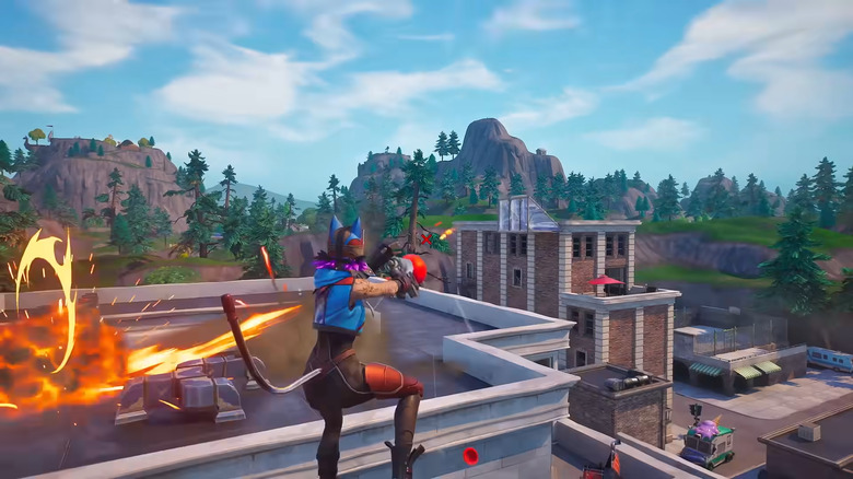 A playable character in a cat outfit leaps into the air firing a machine gun in Fortnite.