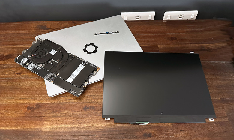 Image of a Framework Laptop 13 and its upgrade components.