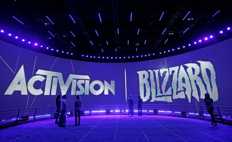 FILE - The Activision Blizzard Booth is shown on June 13, 2013 the during the Electronic Entertainment Expo in Los Angeles. Microsoft is buying Activision Blizzard, Tuesday, Jan. 18, 2022,  for $68.7 billion to gain access to blockbuster games including Call of Duty and Candy Crush. The all-cash deal will let Microsoft accelerate mobile gaming and provide it building blocks for the metaverse, or a virtual environment.