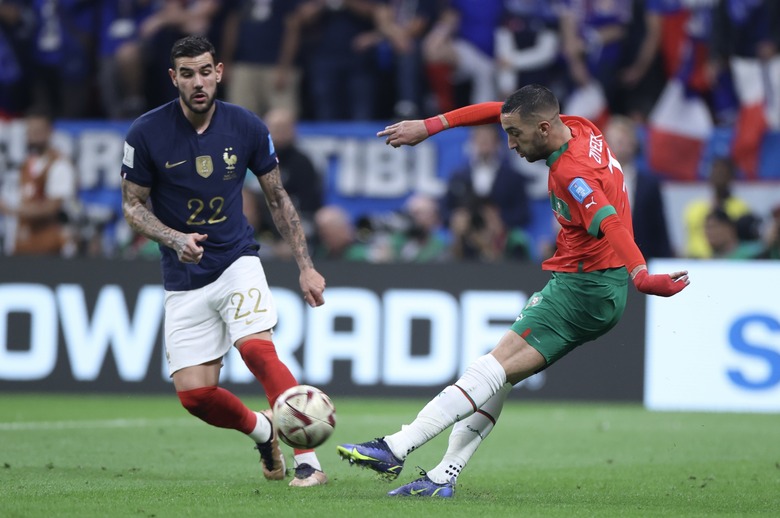 AL KHOR, QATAR - DECEMBER 14: Theo Hernandez (22) of France in action against Hakim Ziyech (R) of Morocco during the FIFA World Cup Qatar 2022 semi-final match between France and Morocco at Al Bayt Stadium on December 14, 2022 in Al Khor, Qatar. (Photo by Fareed Kotb/Anadolu Agency via Getty Images)