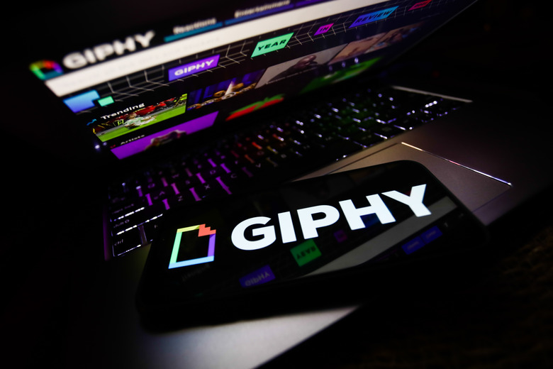 Giphy logo displayed on a phone screen and Giphy website displayed on a laptop screen are seen in this illustration photo taken in Krakow, Poland on November 29, 2021 (Photo by Jakub Porzycki/NurPhoto via Getty Images)