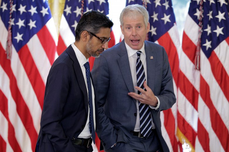 WASHINGTON, DC - SEPTEMBER 04: Google CEO Sundar Pichai (L) talks with U.S. Energy Secretary Chris Wright following a meeting of the White House Task Force on Artificial Intelligence Education in the East Room of the White House on September 04, 2025 in Washington, DC.  This was the second meeting of the task force since it was created as a part of President Donald Trump's April executive order 