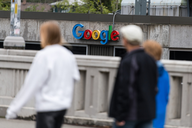 Seattle, USA - Jun 17, 2023: People passing the Fremont neighborhood Google building late in the day.
