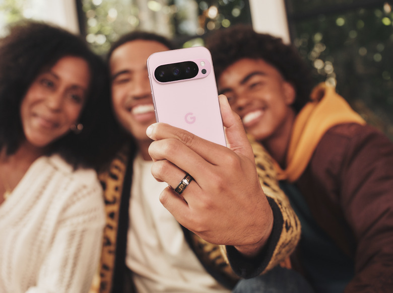 Happy people using a phone.