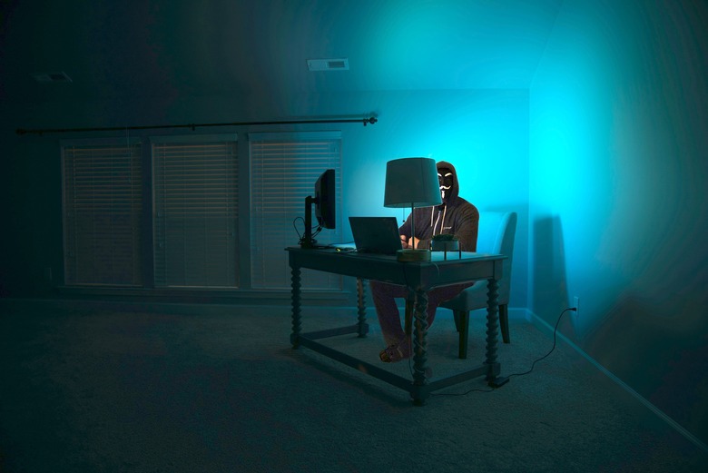A scary hacker in the dark.