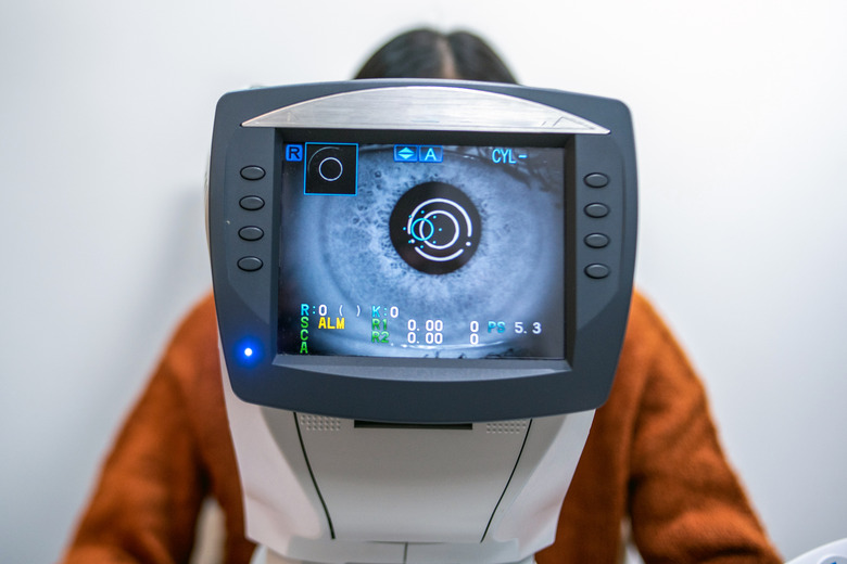 A Women having an eye exam at ophthalmologist's office.