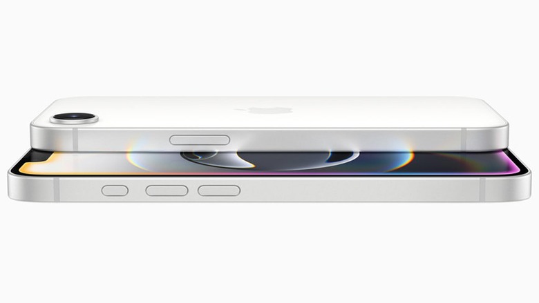 A white iPhone 16e seen from the side, with its OLED display lit. 