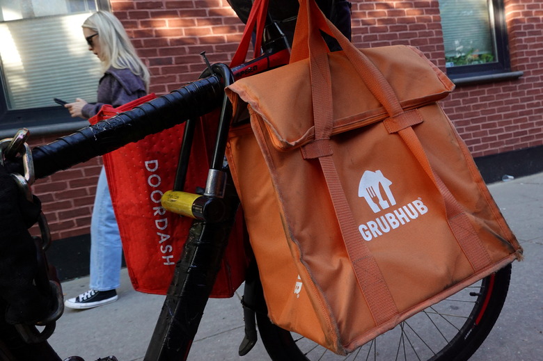 Doordash and Grubhub delivery bags are seen on a bicycle in Brooklyn, New York City, U.S., May 9, 2022. REUTERS/Andrew Kelly