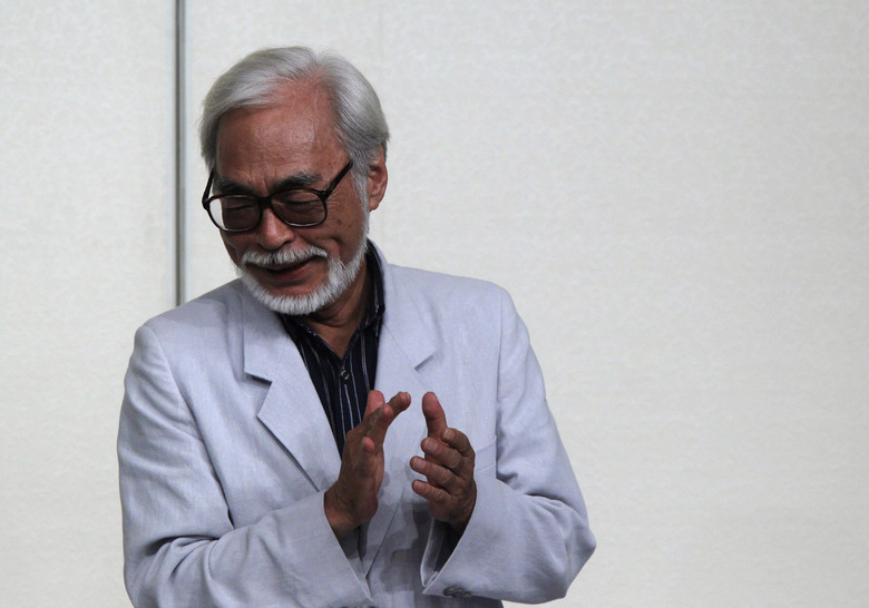 Japanese director Hayao Miyazaki claps his hands after a news conference held to announce his retirement from film in Tokyo September 6, 2013. Miyazaki, known for animated films like the Oscar-winning 