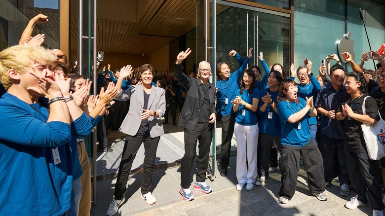 Tim Cook standing in front of an Apple Store