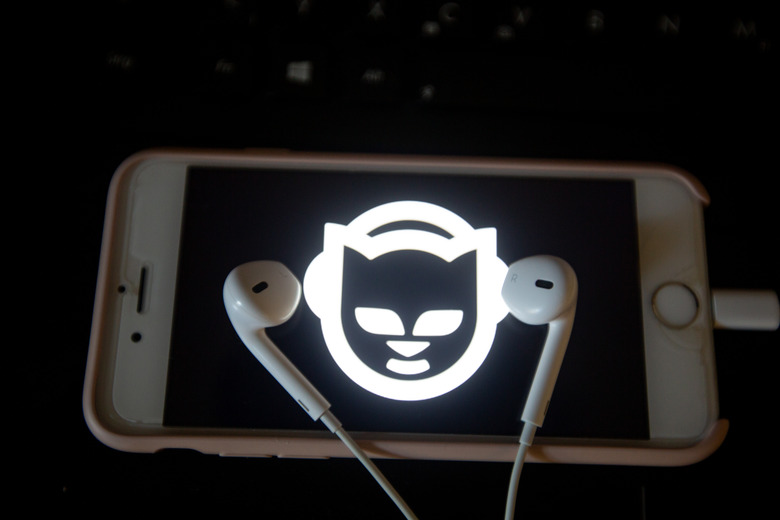 The app of the music streaming app Napster is seen on a screen while some headphones are lying on it. The numbers of people using music streaming apps grow. The biggest one is the Swedish Spotify with 83 million paying users and about 100 others, that use the free version. (Photo by Alexander Pohl/NurPhoto via Getty Images)