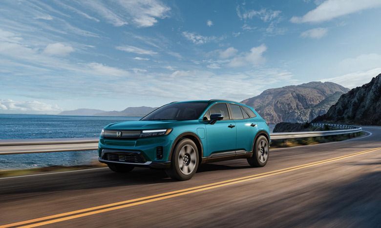 A blue Honda Prologue electric SUV driving down the Pacific Coast Highway.
