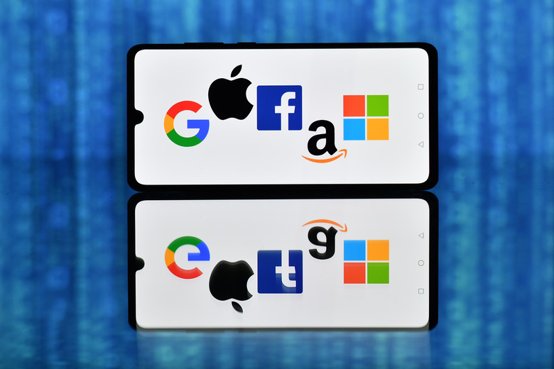 An illustration picture taken in London on December 18, 2020 shows the logos of Google, Apple, Facebook, Amazon and Microsoft displayed on a mobile phone. - Accelerating the transition to an ever more digital life, the coronavirus pandemic has tightened tech giants' grip on billions of customers' lives. (Photo by JUSTIN TALLIS / AFP) (Photo by JUSTIN TALLIS/AFP via Getty Images)