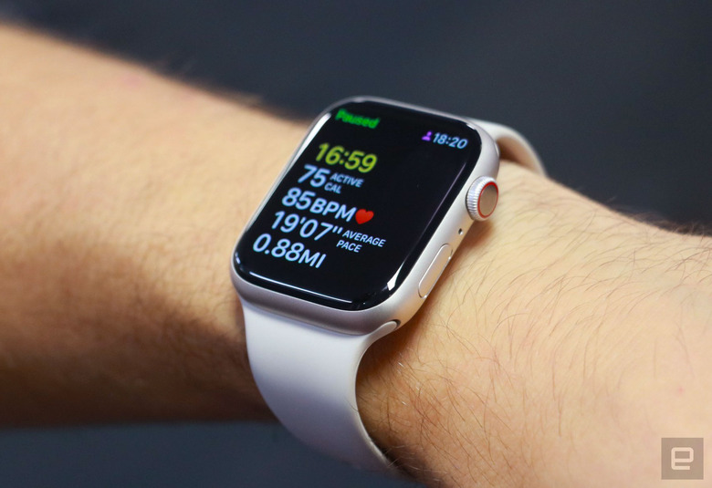 The Apple Watch Series 8 on a person's wrist, showing a paused workout tracking screen.