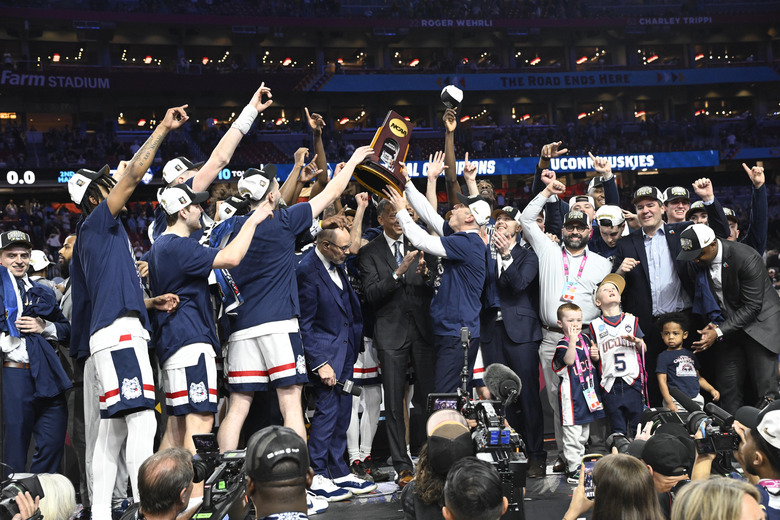 College Basketball: NCAA Final Four: UConn head coach Dan Hurley and team victorious after defeating Purdue during the NCAA Men's Basketball Tournament National Championship game at State Farm Stadium.  Glendale, AZ 4/8/2024  CREDIT: Greg Nelson (Photo by Greg Nelson/Sports Illustrated via Getty Images)  (Set Number: X00004 TK1)