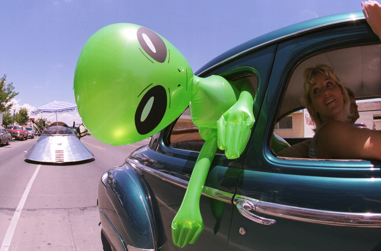 372049 02: An alien doll hangs out a car window in downtown Roswell, New Mexico July 1, 2000 as part of the annual UFO Encounter, which runs through July 4, 2000. The annual festival stems from a mysterious crash northwest of Roswell in 1947. The Army initially said it was a UFO crash, but quickly backed off that report. The Pentagon has since said it was a top-secret balloon crash, but UFO enthusiasts don''t believe that story, which gives rise to what has become known as the 