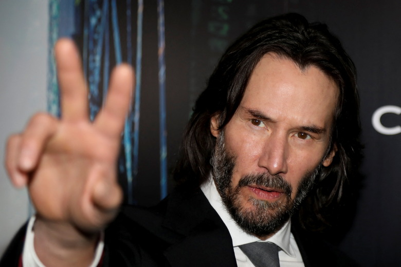 Actor Keanu Reeves gestures during the 