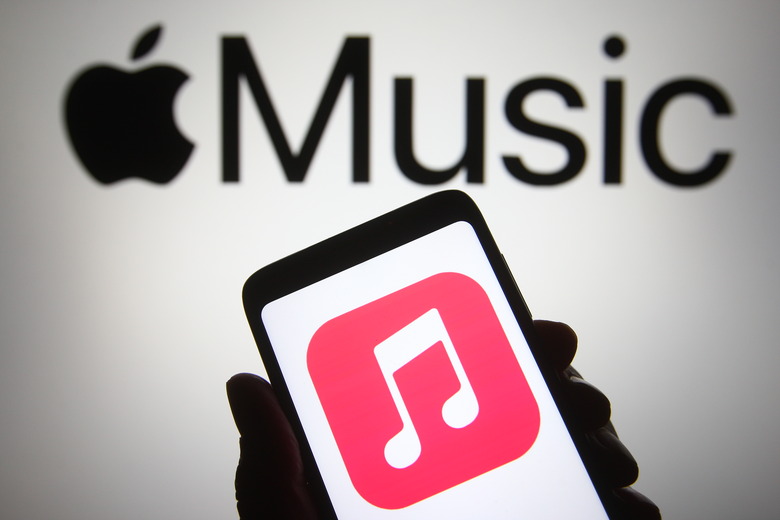 UKRAINE - 2021/04/18: In this photo illustration, Apple Music app seen displayed on a smartphone in front of Apple logo. (Photo Illustration by Pavlo Gonchar/SOPA Images/LightRocket via Getty Images)