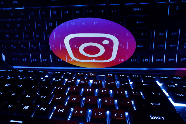 A keyboard is placed in front of a displayed Instagram logo in this illustration taken February 21, 2023. REUTERS/Dado Ruvic/Illustration