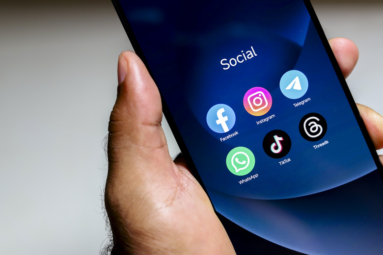 October 8, 2024, Brazil. In this photo illustration, the Facebook, Instagram, WhatsApp, TikTok and Threads apps logo is displayed on a smartphone screen.