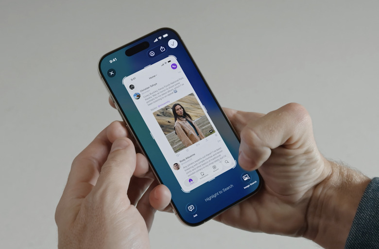 A person holding an iPhone showing the new Visual Intelligence in screenshots feature at WWDC 2025.