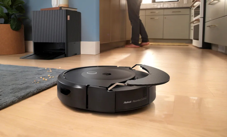 A robovac on a floor.