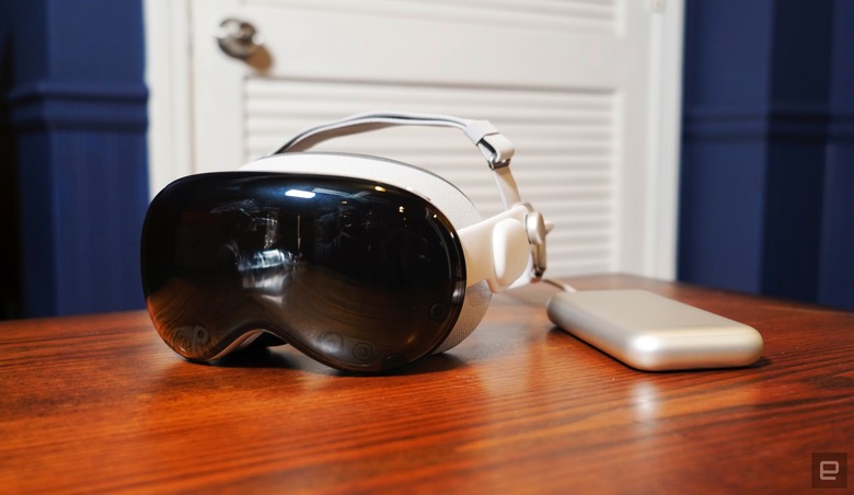 A photo of Apple's Vision Pro headset and its included battery pack.