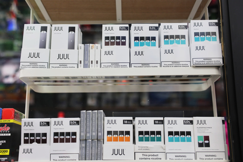 NEW YORK, NEW YORK - DECEMBER 07: Juul packages are seen on a shelf at Empire Smoke Shop on December 07, 2022 in the Flatbush neighborhood of Brooklyn borough in New York City. Juul Labs announced that it has agreed to settle about 5,000 lawsuits in a Northern California court case for an undisclosed amount settling a legal battle over the company's sale and marketing of e-cigarettes that has been blamed for the teenage vaping crisis. (Photo by Michael M. Santiago/Getty Images)