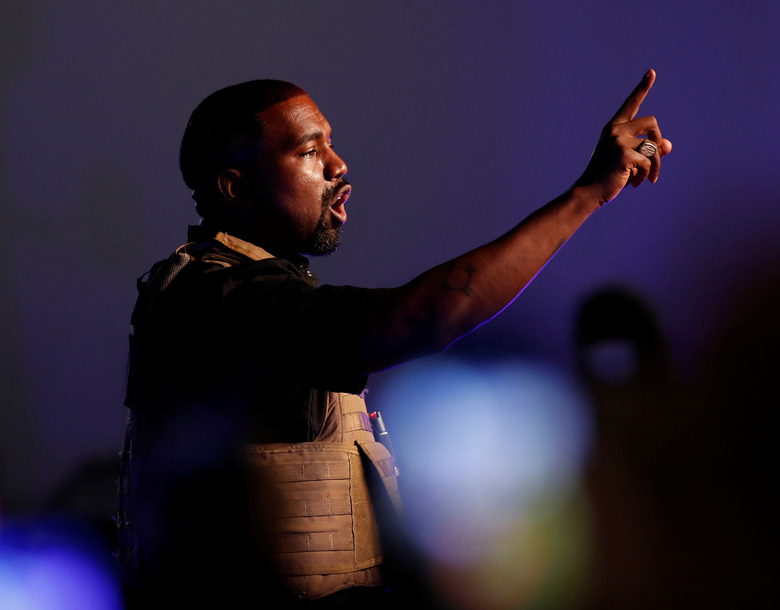 Rapper Kanye West gestures to the crowd as he holds his first rally in support of his presidential bid in North Charleston, South Carolina, U.S. July 19, 2020.  REUTERS/Randall Hill