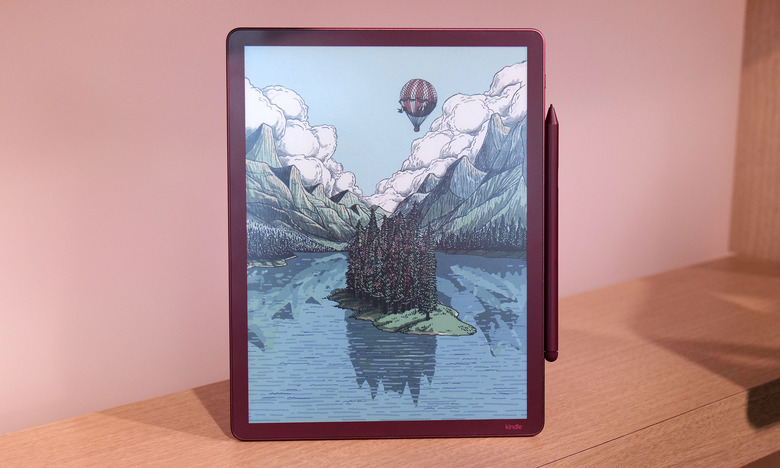 The Kindle Scribe Colorsoft on a shelf with a colorful landscape sketch on its screen.