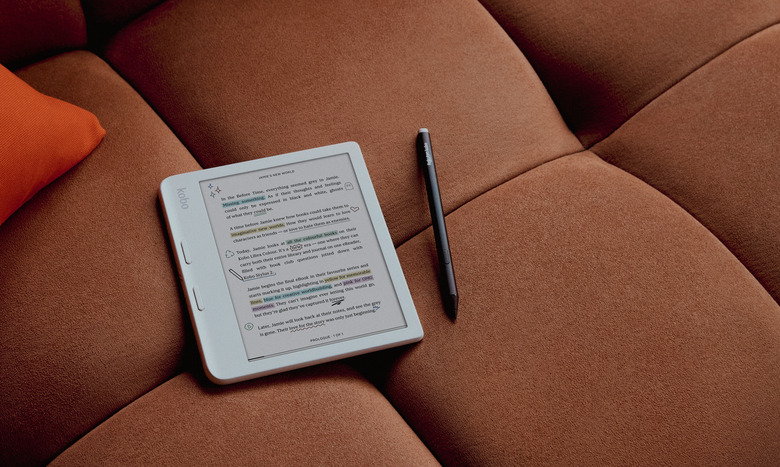 Product lifestyle photo of the Kobo Libra Colour ereader. It sits on a couch with color highlighting and annotations. A stylus sits to its right.