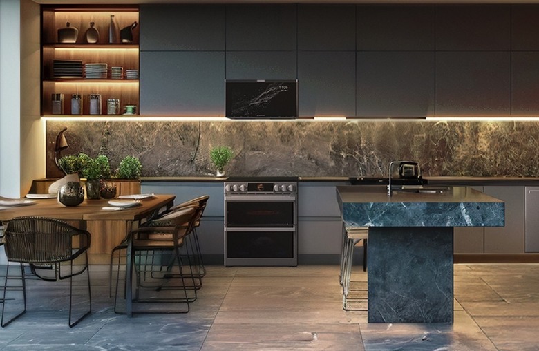 A microwave in a nice kitchen.