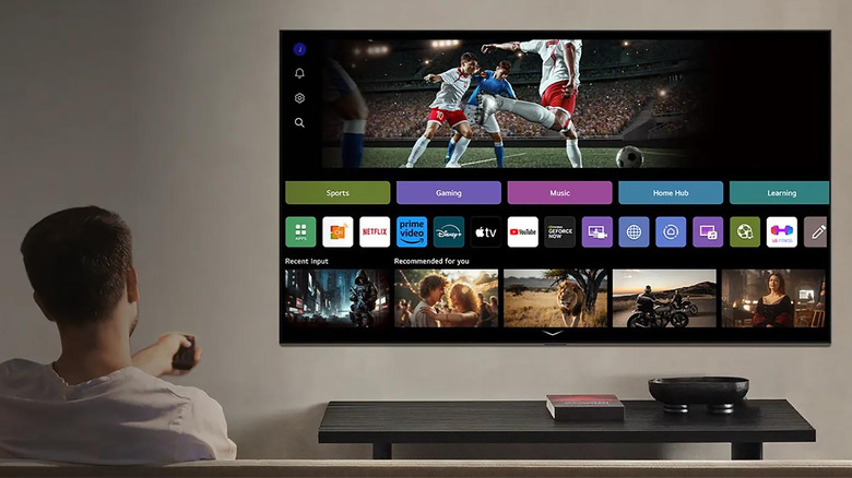 Lifestyle image of a man watching an LG television