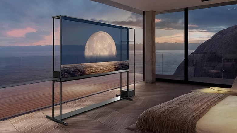 The LG OLED T transparent TV in a posh beachside bedroom.