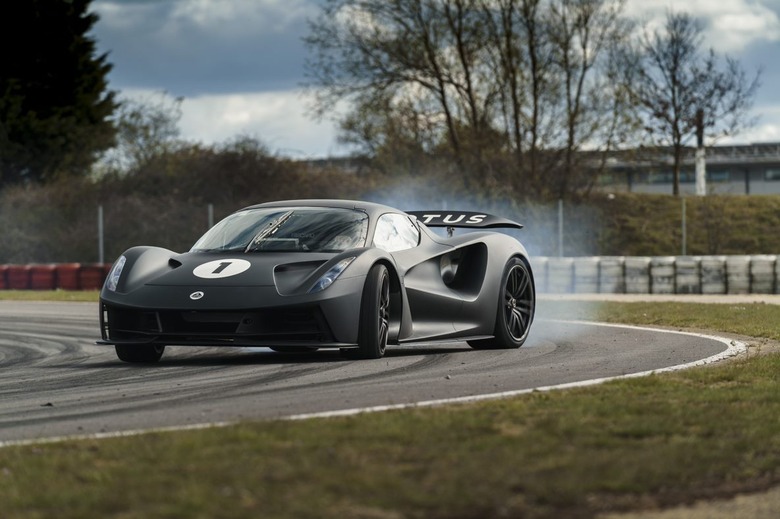 A black Lotus Evija swerving around a track.
