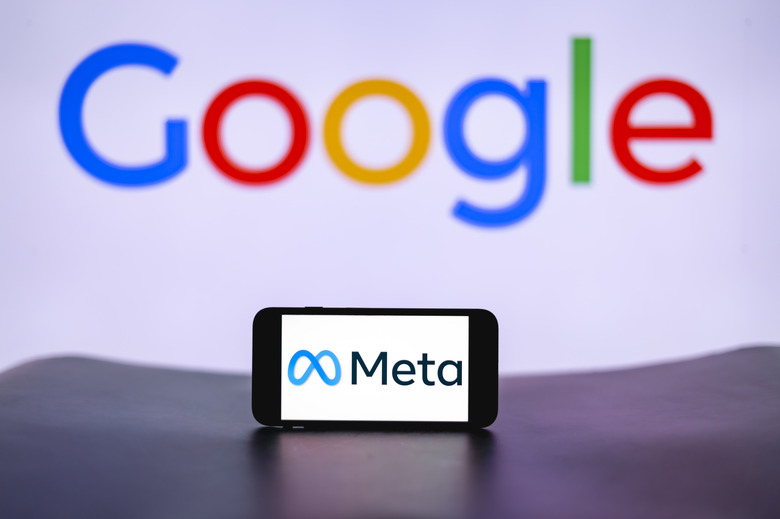 INDIA - 2023/12/13: In this photo illustration, the Meta logo is seen displayed on a mobile phone screen with Google logo in the background. (Photo Illustration by Idrees Abbas/SOPA Images/LightRocket via Getty Images)