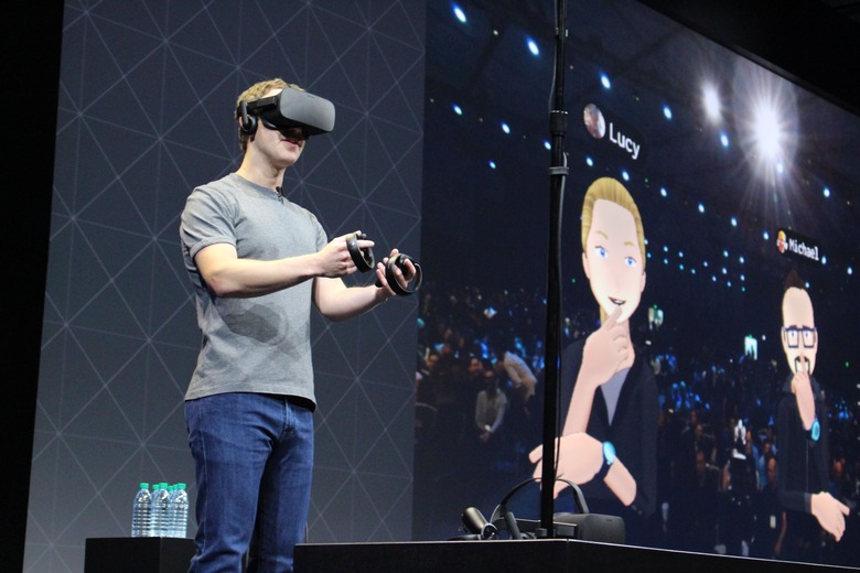 Facebook co-founder and chief executive, Mark Zuckerberg, speaks at an Oculus developers conference while wearing a virtual reality headset in San Jose, California on October 6, 2016.  Facebook unveiled new hardware for its Oculus division as part of a stepped-up effort to integrate virtual reality with the leading social network. The new offerings aim to get an array of virtual reality gear to consumers in the coming months, including a new 