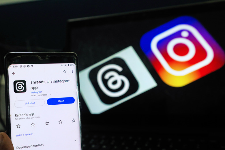 A man shows the newly introduced ''Threads'' app with an Instagram background on July 6, 2023, in Colombo, Sri Lanka. 