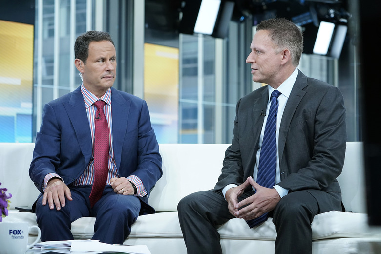 NEW YORK, NEW YORK - AUGUST 09: Fox anchor Brian Kilmeade interviews entrepreneur and venture capitalist (R) Peter Thiel during 