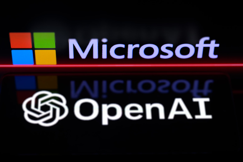 The OpenAI logo is being displayed on a smartphone, with the Microsoft logo visible on the screen in the background, in this photo illustration taken in Brussels, Belgium, on January 6, 2024. (Photo by Jonathan Raa/NurPhoto via Getty Images)
