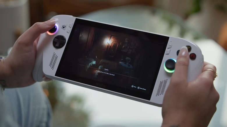 Someone playing a white ASUS ROG Xbox Ally.
