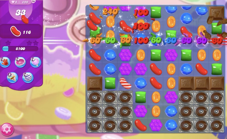 A screenshot of a mobile game showing cartoon candies in a grid.