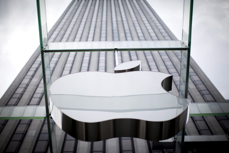 An Apple logo hangs above the entrance to the Apple store on 5th Avenue in the Manhattan borough of New York City, July 21, 2015. Apple Inc said it is experiencing some issues with its App Store, Apple Music, iTunes Store and some other services. The company did not provide details but said only some users were affected. Checks by Reuters on several Apple sites in Asia, Europe and North and South America all showed issues with the services. REUTERS/Mike Segar