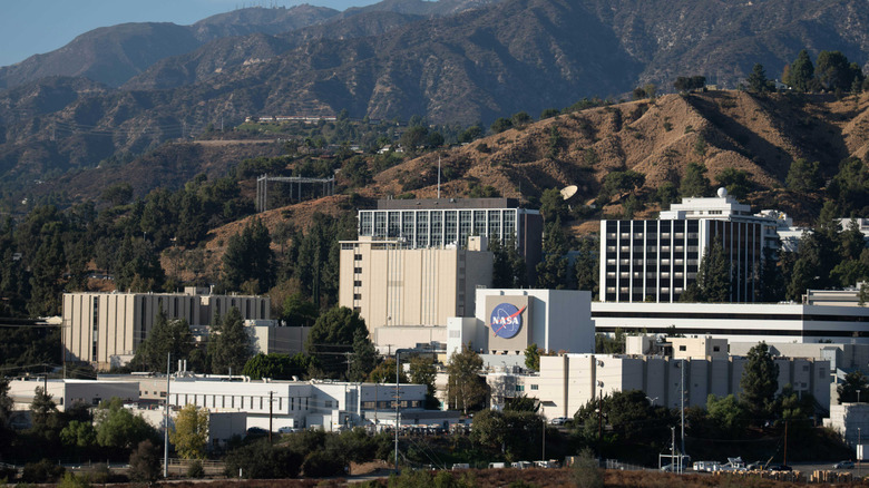 Buildings with mountains in the background.